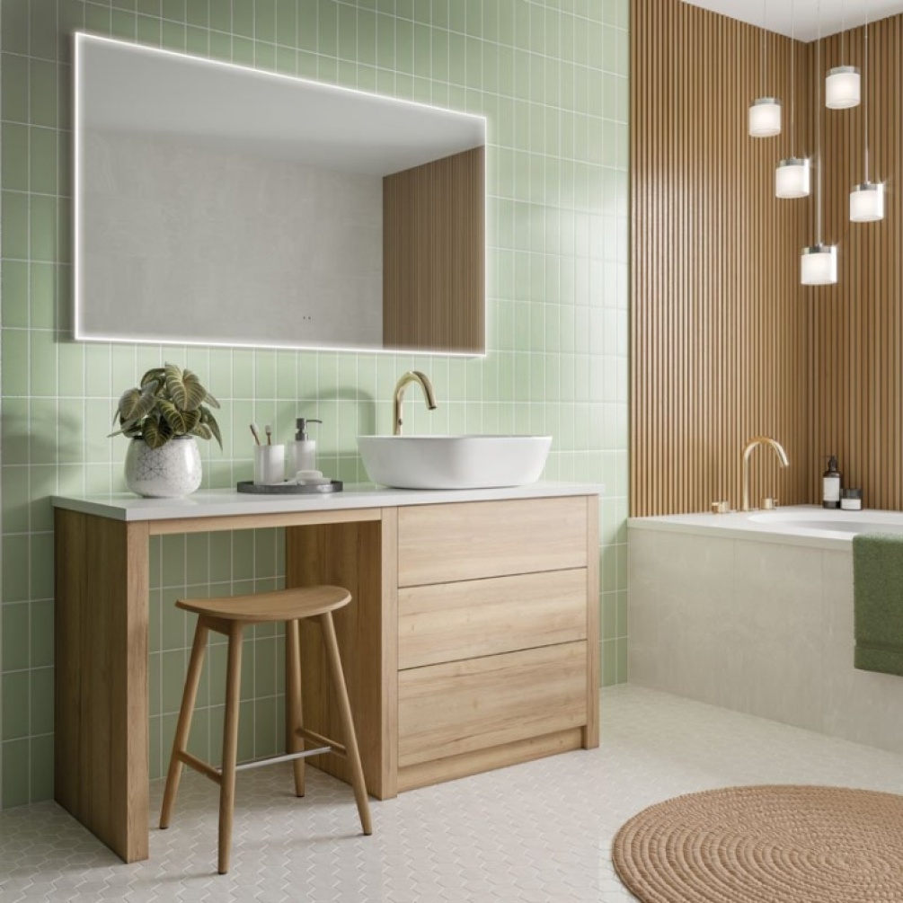 Product Lifestyle image of the HIB Air 1200mm LED Bathroom Mirror mounted on a green tiled wall